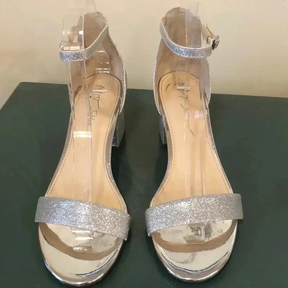 Betsey Johnson Mairi Champagne open toed sandal with rhinestone embellishment.